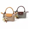 Mini bolso de mano tejido con paja transfronterizo tipo dumpling, bolso de mano retro con tapa abatible, nuevo estilo 2026 bolso tejido para mujer, personalizable para vacaciones
