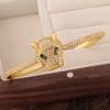 Pulsera de personalidad exagerada animal con cabeza de leopardo de ojos verdes, estilo ins europeo y americano, retro, chapada en cobre liso, 18K, para mujer