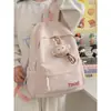 Mochila de moda de color liso con estampado de letras, simple y versátil, estilo japonés, adecuada para estudiantes de secundaria, preparatoria y universidad