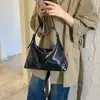 Bolsas de alta gama de nicho para mujer Otoño/Invierno 2026 Nuevo Bolso de Hombro Único Cruzado Versátil Retro Bolso de Axila de Trabajo Tipo Empanada