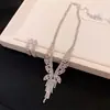 Aretes de borla y collar de oro real de 14k chapado en circonita, juego de dos piezas, conjunto de moda de lujo ligero de alta gama para el día a día