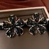 Pendientes de aguja plateada con diamantes y diseño de flor de gota de agua, pendientes vintage de lujo ligero y de alta gama, diseño elegante y único, accesorios para orejas versátiles