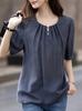 2025 Verano Sentido del Diseño Decoración de Perlas Cuello Redondo Botón Gota de Agua Camisa Elegante de Manga Corta Top para Mujer Camiseta