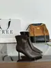 Botas elásticas pretas de salto alto fino estilo francês 2026, botas curtas versáteis para mulheres, botas elásticas pretas justas de couro macio