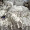 Estilo ins, fresco y simple, juego de ropa de cama de cuatro piezas de algodón puro, diseño de princesa estilo coreano, algodón lavado, estampado floral, ribete floral grande, juego de tres piezas apto para estudiantes