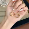 Pendientes Metálicos Huecos Sencillos y Elegantes en Forma de Gota de Agua para Mujer 2026 Nuevo Estilo Pendientes de Personalidad de Gama Alta Pinzas para Orejas Versátiles Accesorios para Orejas