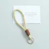 Nuevo cordón para teléfono anudado de bloques de color, llavero DIY hecho a mano, accesorio para bolso, colgante de regalo pequeño, venta al por mayor