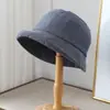 Sombrero de pescador minimalista de lino transpirable estilo japonés con borde enrollado para mujer, protección solar casual, adelgazante, sombrero de sol versátil