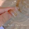 Anillo de set exquisito coreano de alta gama para mujer estilo ins nicho lujo ligero perla abierto anillo de dedo índice joyería al por mayor