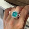 Anillo de Flor Verde Paraíba de Celebrante en Vivo en Línea Lujo para Mujer Imitación de Esmeralda Diamante Completo Girasol Anillo de Dedo