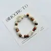 Pulsera de Cerámica Jingdezhen Nueva Historieta China Pulsera Boutique Venta al por Mayor Estudiante Joker Explosiones Puesto del Mercado Nocturno Pulsera