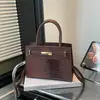 Moda Verano 2026 Nuevo Patrón de Cocodrilo Elegante Simple Versátil Retro Hombro Único Cruzado de Hombro Portátil Bolso Kelly Transfronterizo