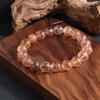 Pulsera de pelo de león natural mica simbiótica dos ruedas negro oro super siete a través del cuerpo hombres y mujeres pulsera de cristal de pelo super negro al por mayor