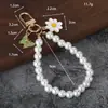 Nuevo colgante de llavero de coche de perlas, lindo accesorio para fundas de auriculares, decoración de bolso, accesorio de cadena colgante para equipaje para mujeres