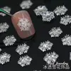 Novos Ornamentos de Unha de Floco de Neve de Natal Atacado Gelo Através de Floco de Neve Tridimensional Peça Brilhante Fina Branca Decoração de Unha de Resina