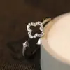 Anillo de Flor Completo de Diamante para Mujer 2025 Nuevo Estilo Lujo Accesible Diseño de Nicho de Gama Alta Anillo Abierto Microincrustado de Zirconia