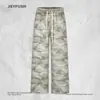 Pantalones casuales de camuflaje para hombre, pantalones deportivos holgados de pierna ancha estilo americano de moda con cordón y cintura elástica, pantalones deportivos versátiles