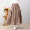 Colección Otoño 2026: Falda midi de cuadros de algodón y lino con cintura elástica, estilo artístico japonés, falda de línea A adelgazante para mujer
