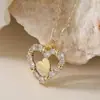 Aogu Moda Transfronteiriça Luxo Acessível Banhado a Cobre Ouro 18K Pingente de Coração com Zircônia Corrente para Clavícula Feminina Nicho de Luxo Novo