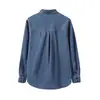 Chic retro francés estilo europeo, nicho, corte holgado, moderna camisa de mezclilla de manga larga en azul, que exuda un aura elegante y refinada