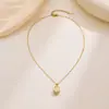 Exquisito Collar de Tulipan Ojo de Gato, Diseño de Nicho de Lujo Ligero, Nueva Cadena Elegante de Acero de Titanio de Moda para Año Nuevo, Venta al por Mayor