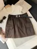 Saia de trabalho retrô com múltiplos bolsos para mulheres, novo design de outono, saia curta casual bodycon de cintura alta afunilada em A