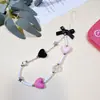 Colgante de funda de teléfono con lazo de chica estilo oscuro, charm de CCD en forma de corazón, tarjetero de cadena, correa colgante Guban, cadena de teléfono versátil