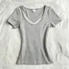 Camiseta de manga corta con cuello redondo y ribete de encaje delicado, estilo europeo y americano transfronterizo, imitación de dos piezas, nuevo modelo negro primavera/verano 2026