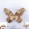 Broche borboleta de hardware de nicho de luxo leve, acessórios de vestuário, acessórios decorativos de metal