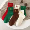 Medias navideñas para niños, otoño e invierno, lindas medias rojas de algodón para Año Nuevo, estilo japonés, lindas medias bordadas con dibujos animados de moda.