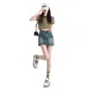 Falda corta de mezclilla estilo americano para mujer, nuevo modelo verano 2026, talla grande, adelgazante, sexy ajustada que realza las caderas falda-pantalón, media falda de cintura alta