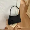 Bolsa tejida de axila de estilo francés de nicho Shuai Mi Jia para mujer, nueva bolsa elegante para el trabajo de otoño 2026, bolso de hombro vintage