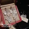 Juego de Anillo de Mariposa Superpuesta de Cardamomo con Gema y Pendientes de Mariposa Pétalo Gota de Agua Flor Exquisita