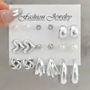 Nuevo Juego de Pendientes de Estilo Europeo y Americano con Rayas Trenzadas, Diseño Retro Geométrico, Sensación Simple y de Alta Gama, Juego de Pendientes de Botón de Nueve Piezas para Mujer