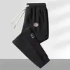 Pantalones de chándal de pana para hombre para otoño, pantalones casuales de retazos, corte holgado, pantalones jogger versátiles y modernos, pantalones largos para hombre