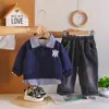 Conjunto de Ropa de Otoño para Niños 2026 Nuevo Estilo Bebé Primavera y Otoño Elegante Botones Manga Larga Dos Piezas Casual Estilo Coreano Moderno Venta al por Mayor