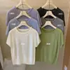 Nuevo Estilo 2026 Recomendado para Principios de Primavera: Top de Verano de Punto de Color Sólido, Cuello Redondo Simple, Manga Corta, Calado, Ajustado