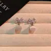 Brincos de Zircônia Pérola com Laço Estilo Luxo Leve para Mulheres Design de Nicho Brincos Versáteis Brincos de Temperamento de Celebridade da Internet Atacado