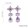 Aretes de poste plateados con diseños florales y de lágrima incrustados con diamantes, aretes llamativos únicos y elegantes para mujer, aretes de lujo ligero de alta gama con un diseño de nicho