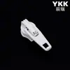 Cremallera Ykk No. 3 Deslizadores de Nylon para Maletas, Cadenas, Fundas de Edredón, Mosquiteros, Fundas de Almohada, Cabezales de Cremallera Ykk en Grandes Cantidades en Stock