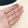 Marco abrasivo de gota de pegamento con figura geométrica de gota de agua de amor hueca de cuatro colores, accesorios de joyería de aleación DIY al por mayor