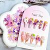 Venta al por mayor en vivo de TikTok, joyería de uñas moradas mixtas, estilo fresco para niñas, decoración de armadura