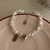 Pulsera de Perlas Barrocas Dulces y Frescas con Colgante de Corazón para Mujer Diseño de Nicho Ins Moda Elegante Joyería con Etiqueta de Suerte y Felicidad