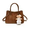 Otoño 2026 Nuevo Estilo Coreano Personalizado Retro Color Sólido Bolso de Hombro Único para Mujer Bolso de Mano de Alto Valor Simple y Moderno Bolso Cruzado