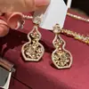 Modernos y Minimalistas Brazaletes para Oreja Retorcidos de Piedra Ojo de Tigre para Mujer, Pendientes Versátiles Vintage, Accesorios para Orejas de Otoño e Invierno con un Toque de Lujo Ligero y de Alta Gama