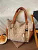 Bolso de lona de color liso para mujer 2026, bolso de hombro de gran capacidad, bolso tote elegante para estudiantes, bolso de mano y bolso cruzado