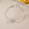 Pulsera de acero de titanio de cuerpo entero de venta caliente transfronteriza para mujer, temperamento de lujo ligero, coreana, galvanoplastia de oro real de 18K, venta al por mayor de joyería