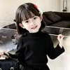 Camisetas térmicas para niños 2026 otoño e invierno nuevo estilo, nueva camiseta de manga larga con cuello semi-alto estilo chino para niñas, camiseta interior cálida