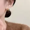 Pendientes de Nudo de Cuerda Dorada 2026 para Mujer, Diseño de Nicho de Lujo Ligero, Temperamento Único de Gama Alta, Clips para Orejas Únicos, Nuevos Pendientes al Por Mayor