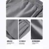 Pantalones cortos casuales de verano para hombre, pantalones deportivos finos, holgados, de seda negra, para hombre